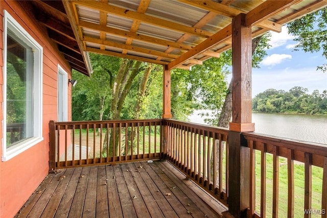 wooden deck featuring a water view