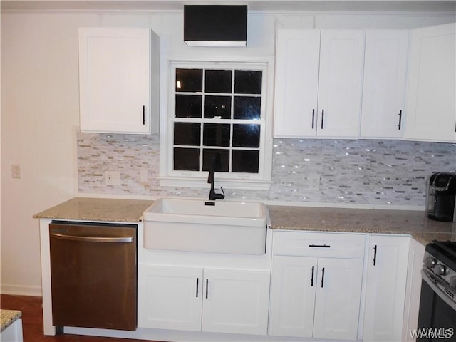 kitchen with white cabinets, sink, appliances with stainless steel finishes, and tasteful backsplash