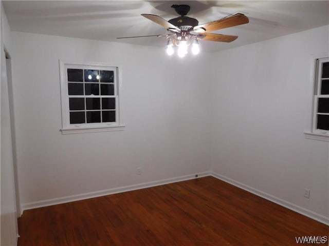 empty room with ceiling fan and wood-type flooring