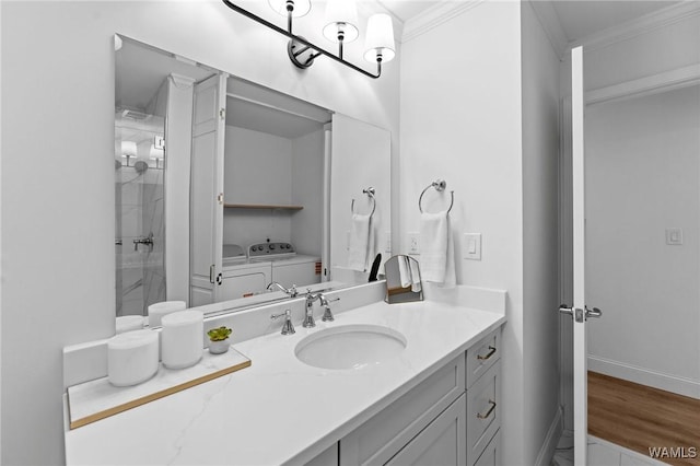 1228 8th St Unit 412, Tuscaloosa, AL 35401 - full bath with vanity, ornamental molding, marble look tiles, washing machine and clothes dryer, and a shower
