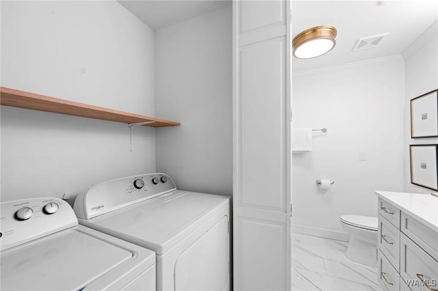 1228 8th St Unit 412, Tuscaloosa, AL 35401 - washroom featuring independent washer and dryer, light marble finish floors, and crown molding