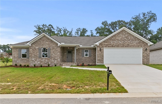 view of front of house featuring a garage and a front yard