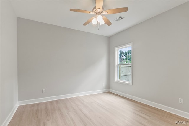 spare room featuring ceiling fan and light hardwood / wood-style floors