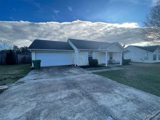 single story home featuring a garage and a front lawn