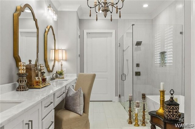 6020 Carleton Park Cir, Tuscaloosa, AL 35406 - bathroom featuring ornamental molding, double vanity, a stall shower, a chandelier, and recessed lighting