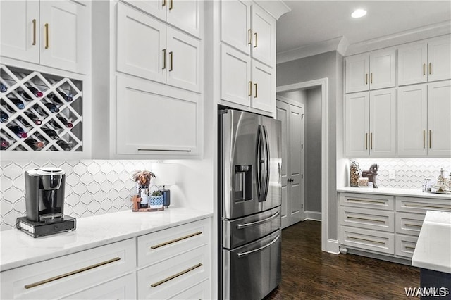 6020 Carleton Park Cir, Tuscaloosa, AL 35406 - kitchen with stainless steel fridge with ice dispenser, white cabinets, tasteful backsplash, dark wood-style flooring, and light stone counters