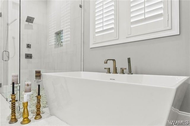 6020 Carleton Park Cir, Tuscaloosa, AL 35406 - bathroom featuring a freestanding bath and a shower stall