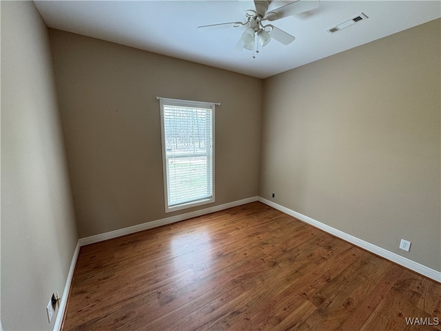 unfurnished room featuring hardwood / wood-style flooring and ceiling fan