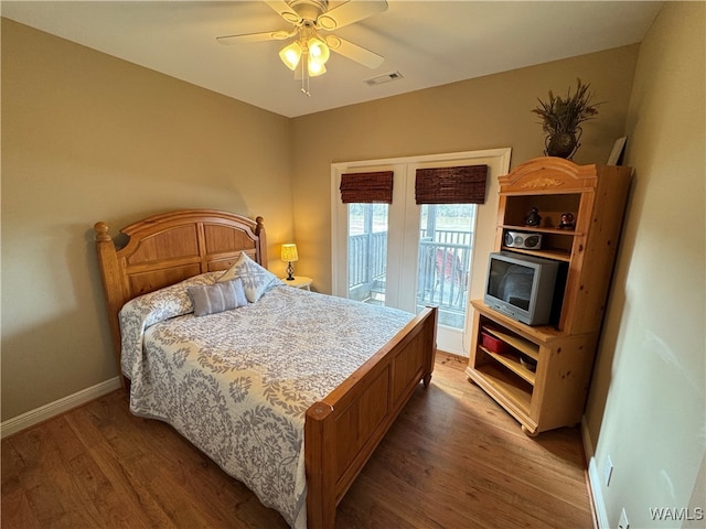 bedroom featuring access to outside, ceiling fan, and wood-type flooring