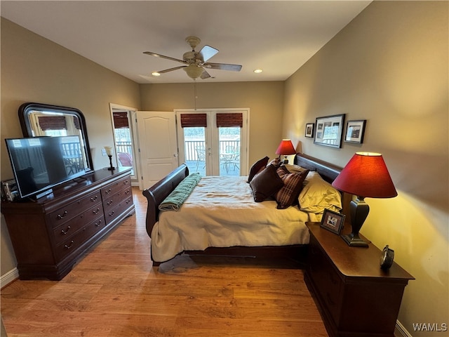 bedroom with light hardwood / wood-style flooring, ceiling fan, and access to outside