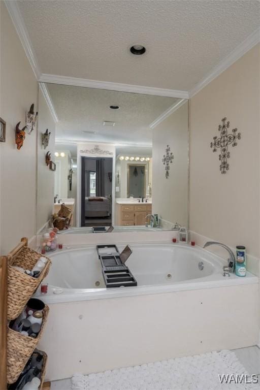 1606 Mallard Cir, Tuscaloosa, AL 35405 - bathroom featuring ornamental molding, a jetted tub, vanity, and a textured ceiling
