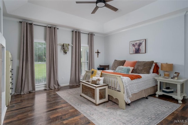 1606 Mallard Cir, Tuscaloosa, AL 35405 - bedroom featuring a tray ceiling, wood finished floors, a ceiling fan, and baseboards