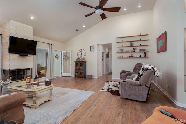 1606 Mallard Cir, Tuscaloosa, AL 35405 - living room with a ceiling fan, high vaulted ceiling, wood finished floors, baseboards, and a large fireplace