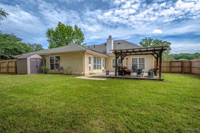 1606 Mallard Cir, Tuscaloosa, AL 35405 - back of property featuring a pergola, a storage unit, a patio, a chimney, and an outdoor structure