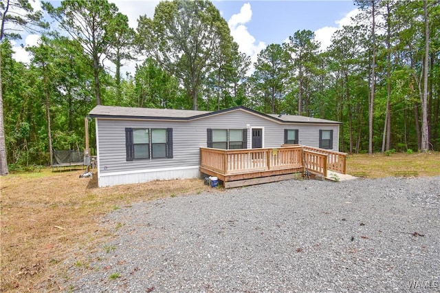 14371 Paul Mills Rd, Buhl, AL 35446 - manufactured / mobile home featuring a trampoline and a wooden deck