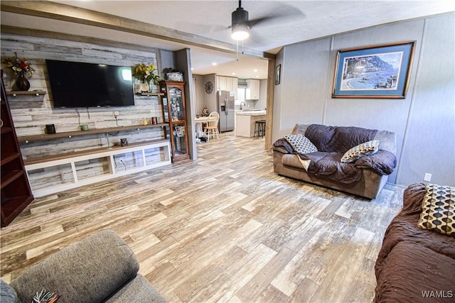 14371 Paul Mills Rd, Buhl, AL 35446 - living area with light wood-type flooring, ceiling fan, and wood walls
