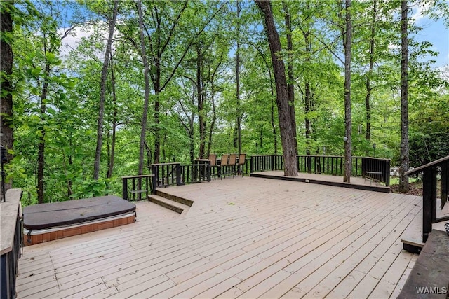 wooden terrace featuring a covered hot tub