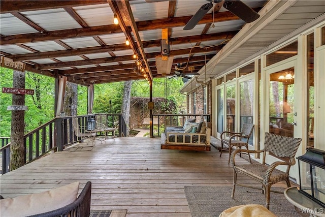 wooden terrace featuring ceiling fan