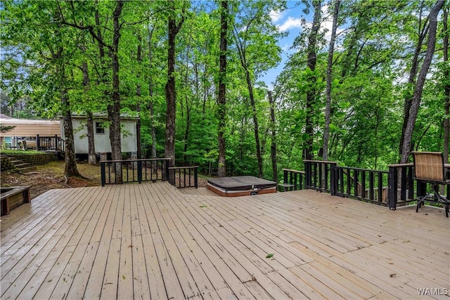 wooden terrace with an outdoor structure and a storage unit