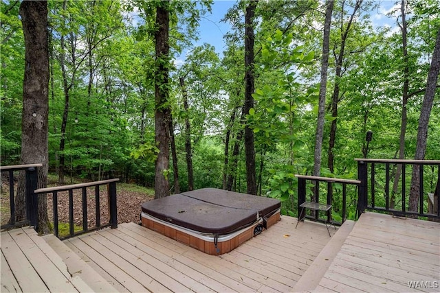 deck with a covered hot tub