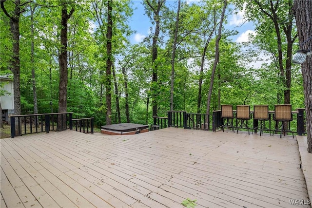 deck with a hot tub