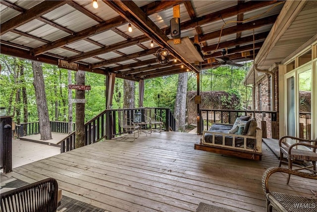 wooden terrace featuring ceiling fan
