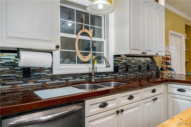 kitchen featuring stainless steel dishwasher, decorative backsplash, white cabinets, and dark countertops