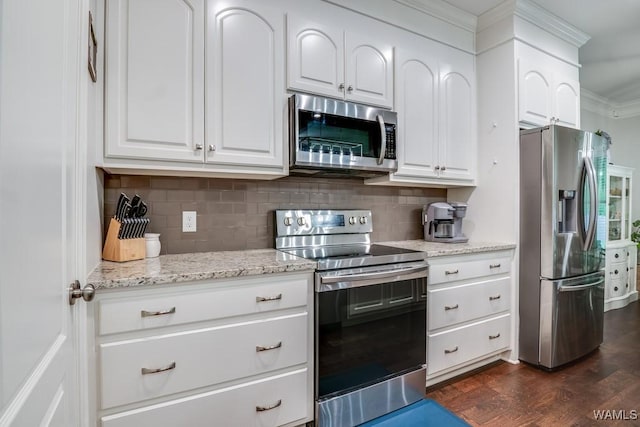 13782 Highland Pointe Dr, Northport, AL 35475 - kitchen featuring appliances with stainless steel finishes, decorative backsplash, white cabinets, dark wood-style flooring, and ornamental molding