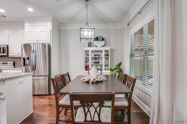 13782 Highland Pointe Dr, Northport, AL 35475 - dining room featuring a chandelier, dark wood-style floors, crown molding, and recessed lighting