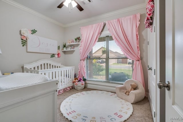 13782 Highland Pointe Dr, Northport, AL 35475 - bedroom featuring light colored carpet, ornamental molding, a crib, and ceiling fan