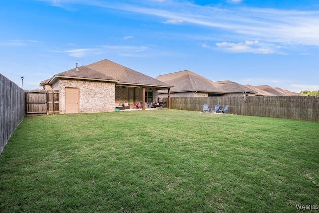 13782 Highland Pointe Dr, Northport, AL 35475 - back of property featuring brick siding and a shingled roof