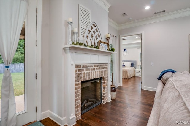 13782 Highland Pointe Dr, Northport, AL 35475 - living area featuring dark wood finished floors, a fireplace, crown molding, and baseboards