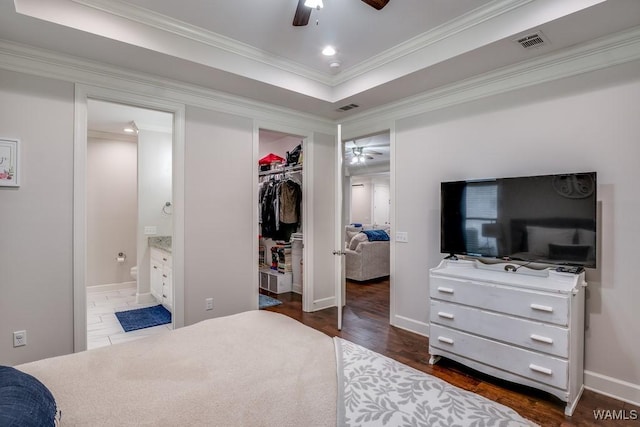 13782 Highland Pointe Dr, Northport, AL 35475 - bedroom featuring wood finished floors, a spacious closet, crown molding, a closet, and baseboards