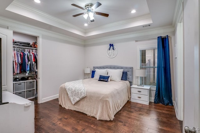 13782 Highland Pointe Dr, Northport, AL 35475 - bedroom with a raised ceiling, dark wood-style flooring, ornamental molding, baseboards, and recessed lighting