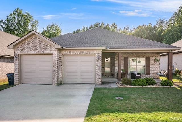 13782 Highland Pointe Dr, Northport, AL 35475 - view of front facade featuring a garage, concrete driveway, roof with shingles, and brick siding