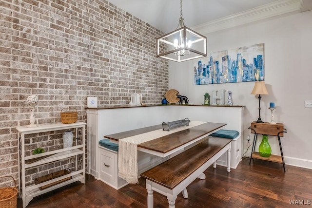 13782 Highland Pointe Dr, Northport, AL 35475 - dining space featuring a chandelier, ornamental molding, wood finished floors, baseboards, and breakfast area