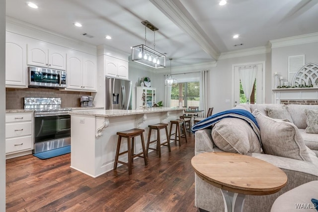 13782 Highland Pointe Dr, Northport, AL 35475 - kitchen featuring stainless steel appliances, a kitchen bar, light stone counters, white cabinets, and dark wood finished floors
