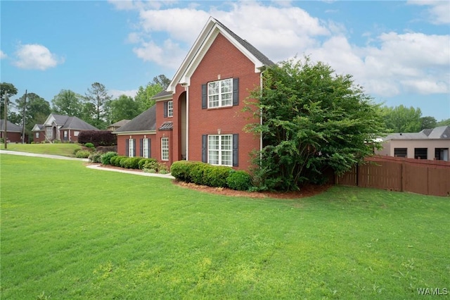 view of side of home with brick siding