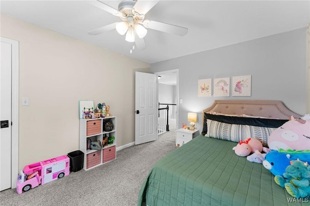 bedroom featuring carpet, a ceiling fan, and baseboards