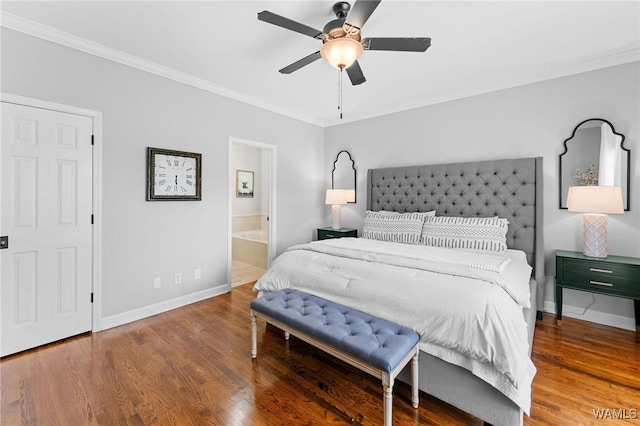bedroom with baseboards, ornamental molding, wood finished floors, ensuite bath, and ceiling fan