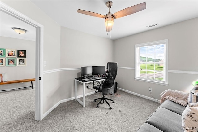 office area featuring carpet floors, baseboards, and a ceiling fan