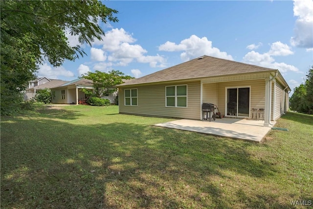 11621 Cedar Glades Dr, Vance, AL 35490 - back of house with a lawn and a patio area