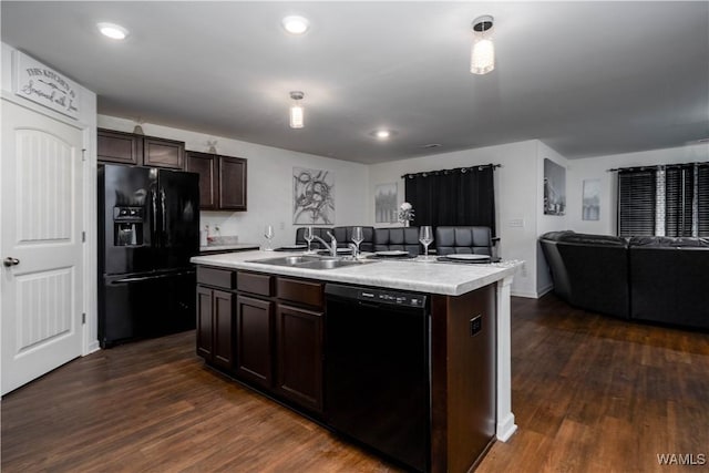 11621 Cedar Glades Dr, Vance, AL 35490 - kitchen featuring black appliances, open floor plan, a center island with sink, dark wood-style floors, and a sink
