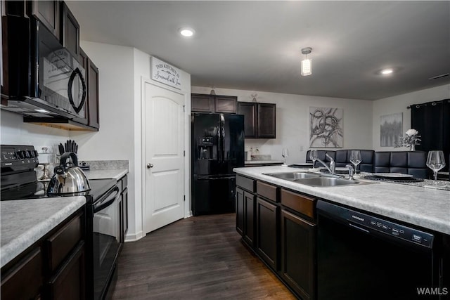 11621 Cedar Glades Dr, Vance, AL 35490 - kitchen with black appliances, a sink, dark wood finished floors, light countertops, and recessed lighting