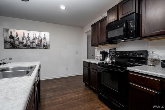 11621 Cedar Glades Dr, Vance, AL 35490 - kitchen featuring black appliances, a sink, dark brown cabinetry, dark wood-style flooring, and recessed lighting