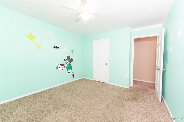 unfurnished bedroom with carpet flooring and ceiling fan