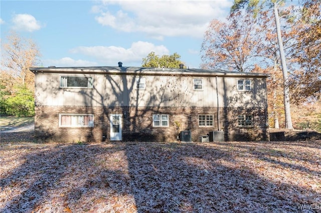 rear view of property featuring central air condition unit