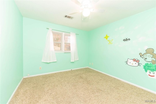 unfurnished room featuring carpet flooring and ceiling fan