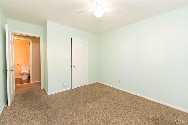 unfurnished bedroom with carpet, a closet, and ceiling fan