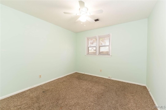 unfurnished room featuring carpet floors and ceiling fan